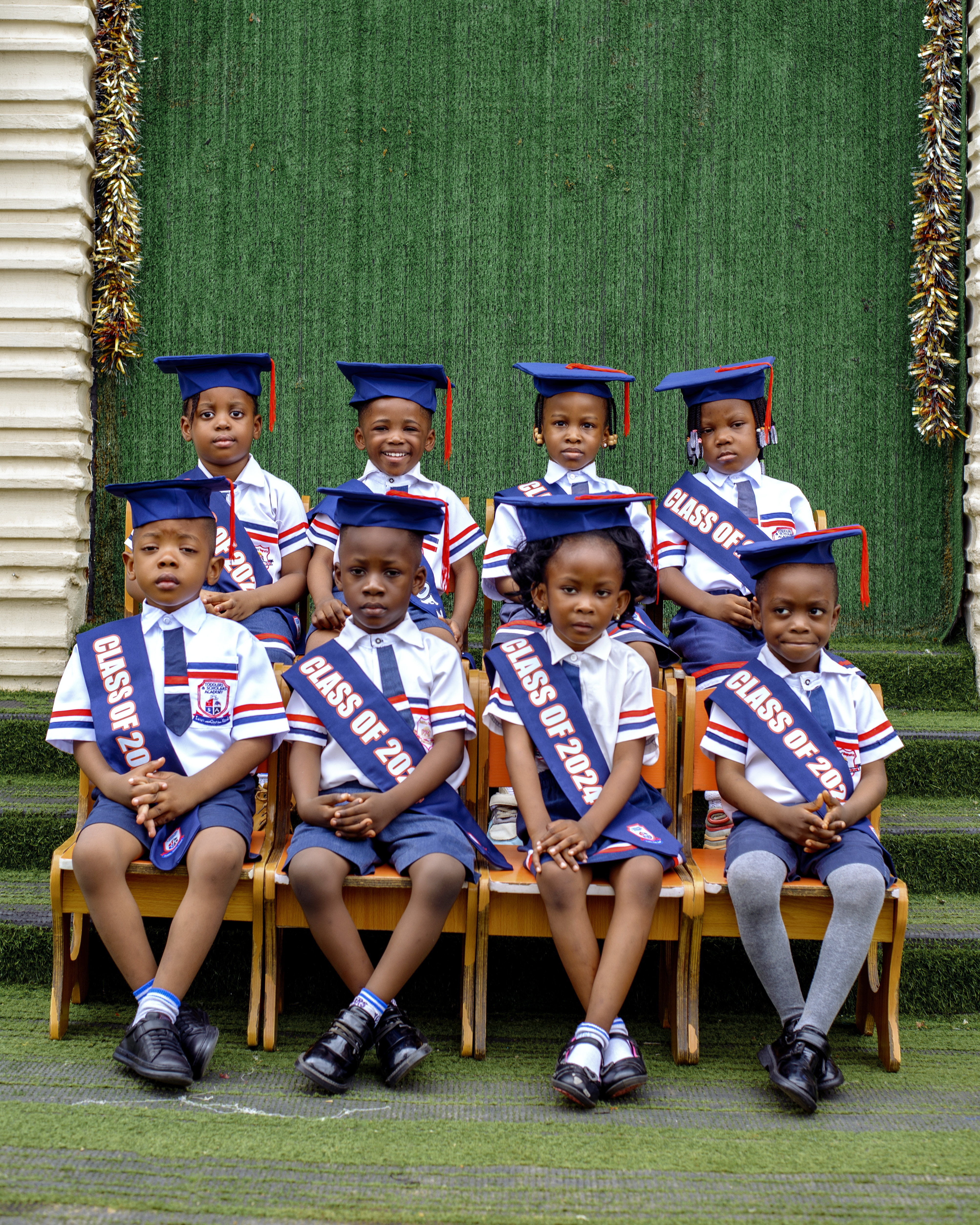 Graduates — green backdrop portrait